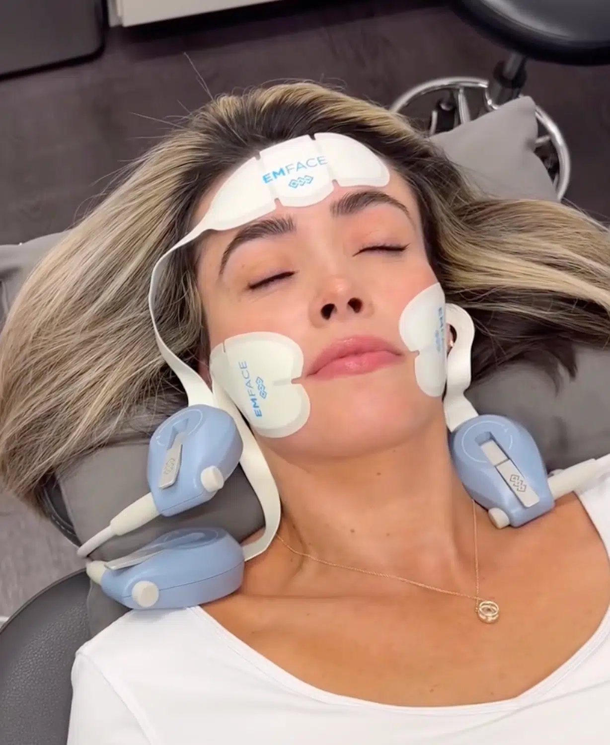 woman receiving emsculpt face treatment at bcrn woman receiving emsculpt face treatment at bcrn