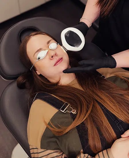 woman receiving ipl laser treatment at bcrn x woman receiving ipl laser treatment at bcrn x